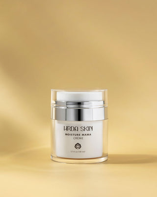 Jar of Hrda Skin Moisture Mama Crème on a gold background